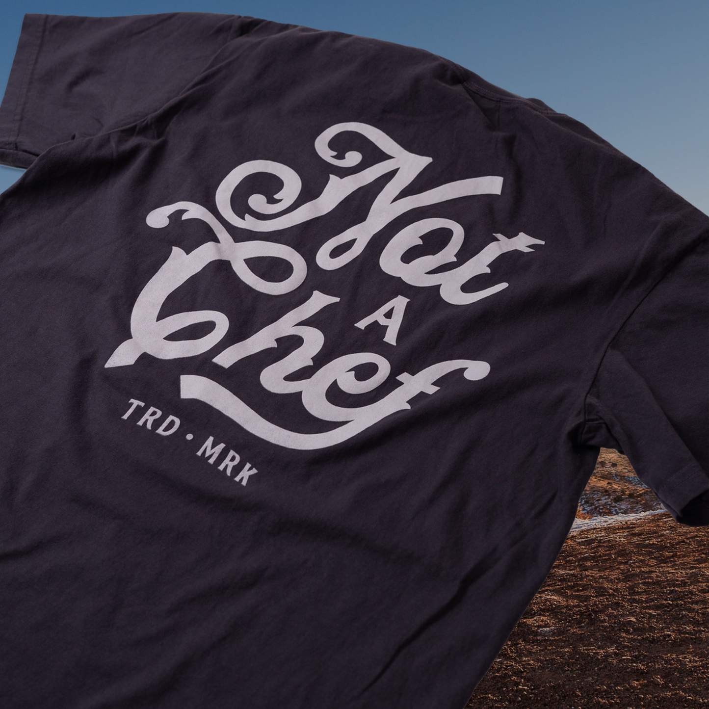 
                  
                    Not a Chef TRDMRK Tee
                  
                